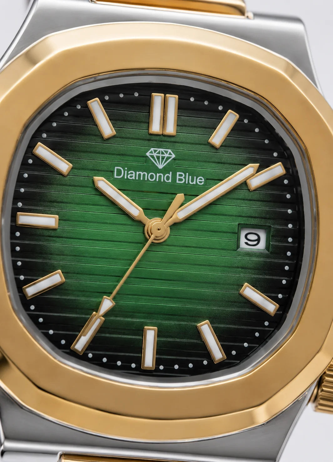 Close-up of the Diamond Blue DB-002 emerald green textured dial with gold bezel, date display and luminous hour markers.