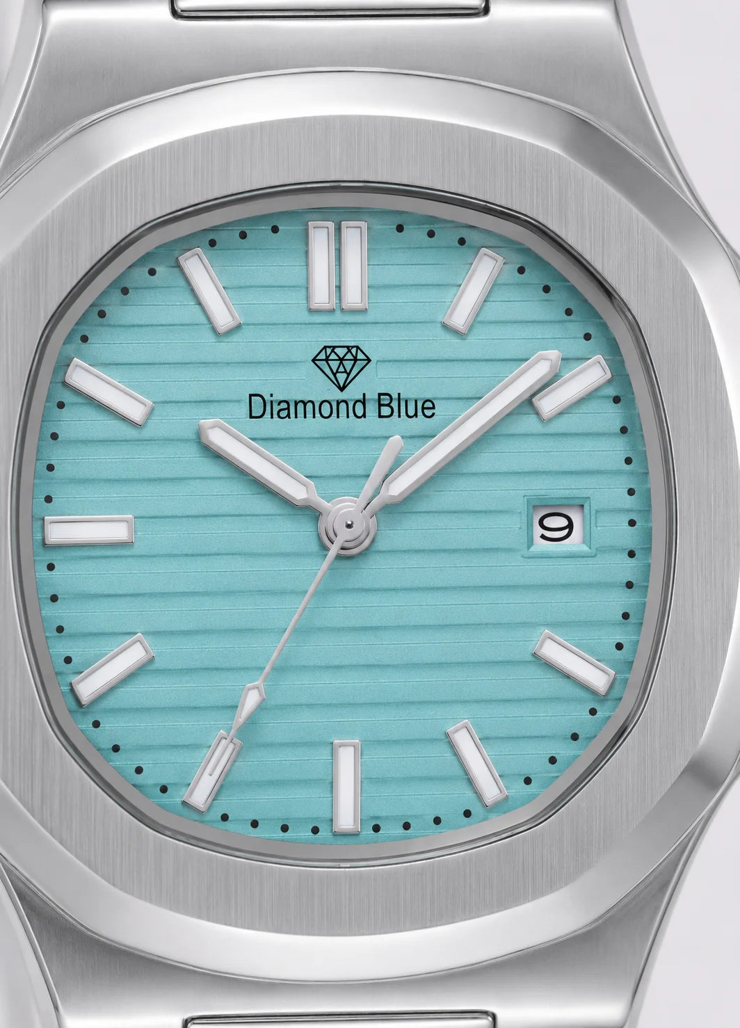 Close-up of Diamond Blue DB-005 Tiffany blue textured dial with silver hour markers and date display.
