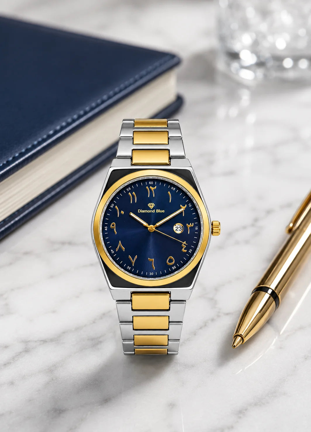 Diamond Blue DB-012 luxury men's two-tone silver and gold watch with blue Arabic numeral dial displayed on a marble surface.
