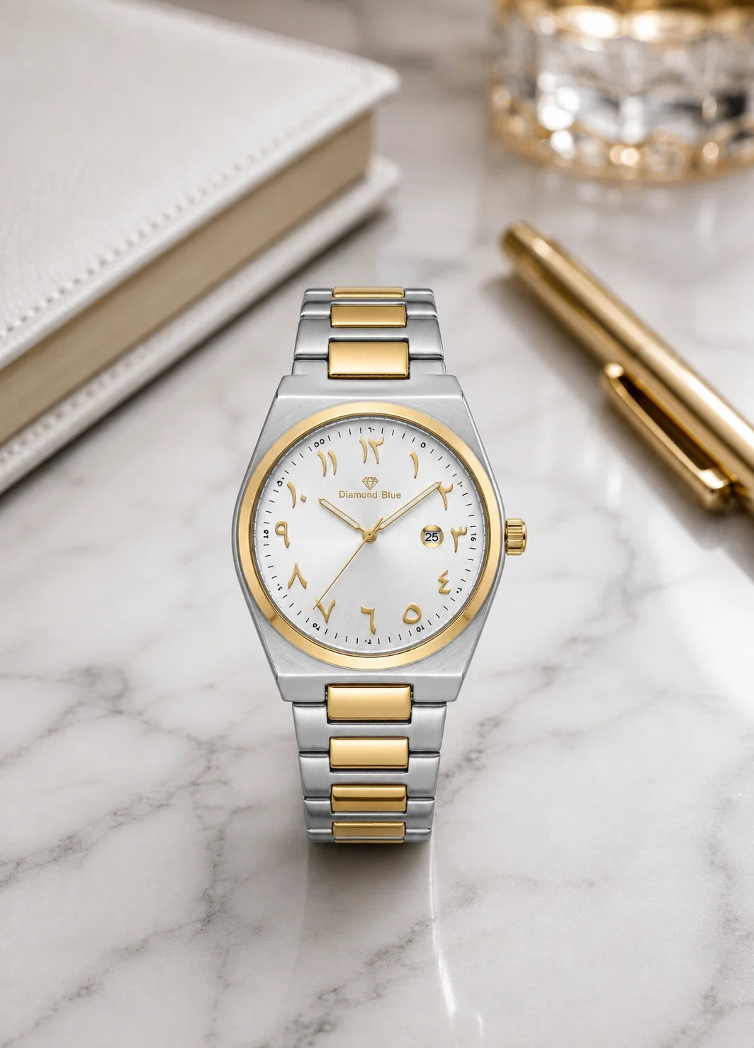 Diamond Blue DB-015 silver dial two-tone men's watch with gold Arabic numerals and stainless steel bracelet on a premium desk.