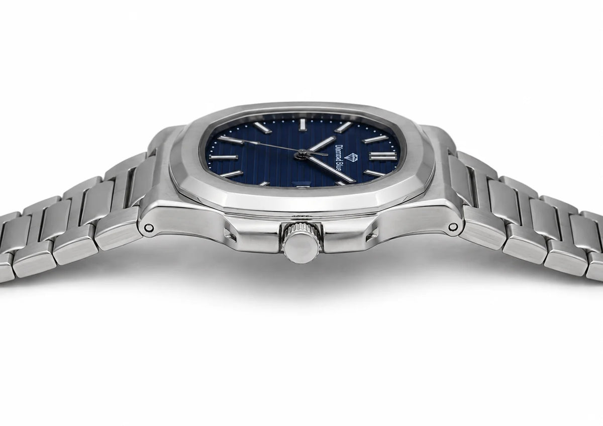 Three-quarter view of Diamond Blue DB-001 luxury stainless steel watch with blue textured dial.